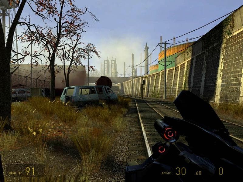 Half-Life 2 gameplay showing the Gravity Gun in an abandoned industrial environment